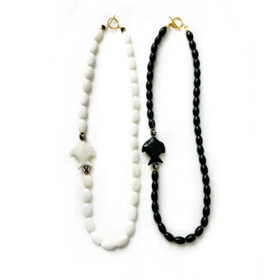 fish necklaces, black or white